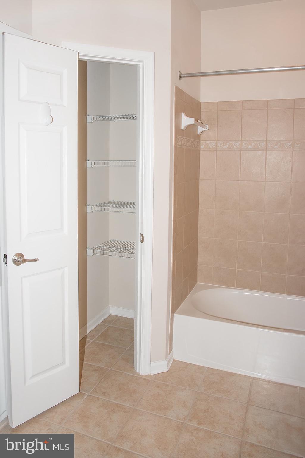 1622 Hardwick Court, Unit 202 Hanover, MD 21076 - Photo 22 of 25 a bathroom with a bathtub and a shower