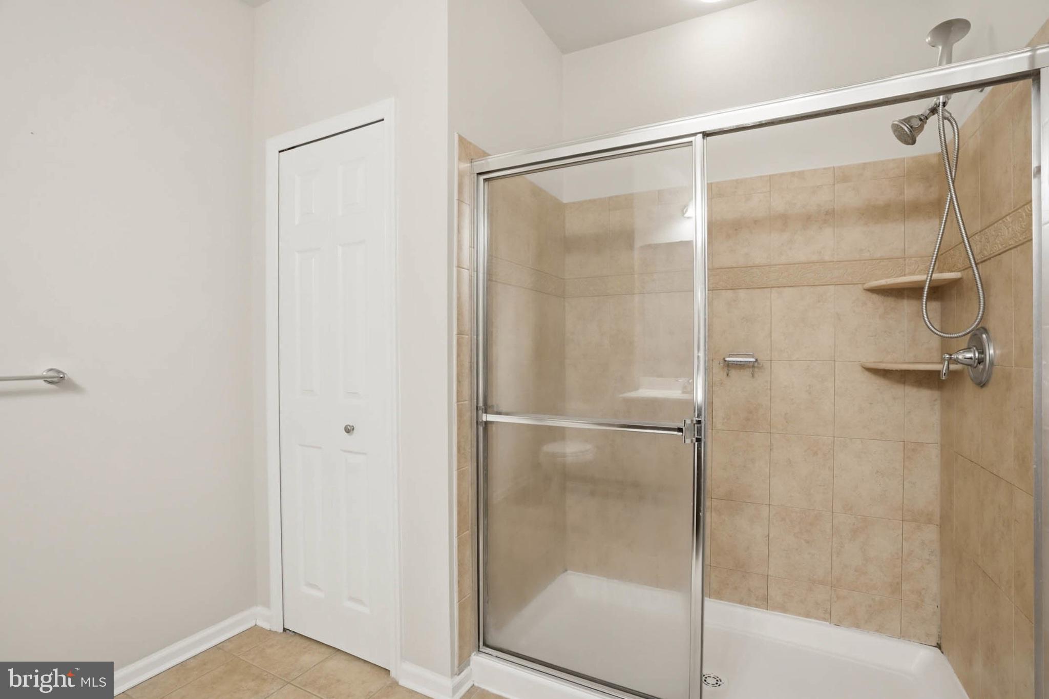 1622 Hardwick Court, Unit 202 Hanover, MD 21076 - Photo 25 of 60 Sleek modern shower with elegant tiles.
