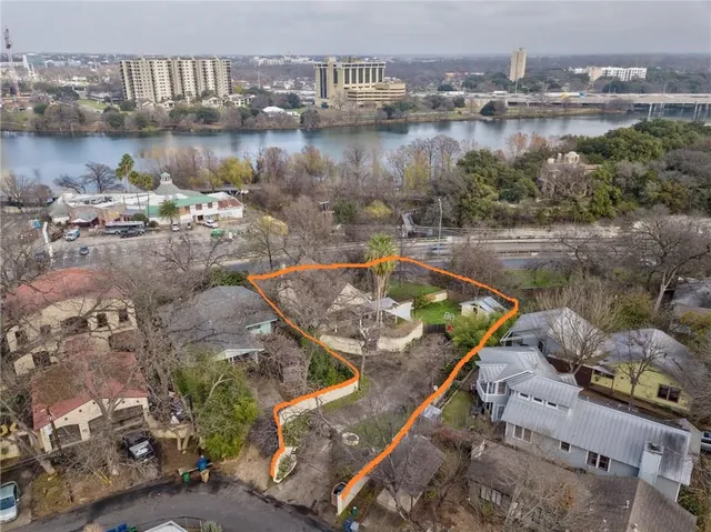 an aerial view of a house with lake view
