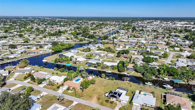 an aerial view of a city with ocean view