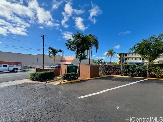 a view of street with parked cars