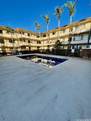 a view of a swimming pool with a chair