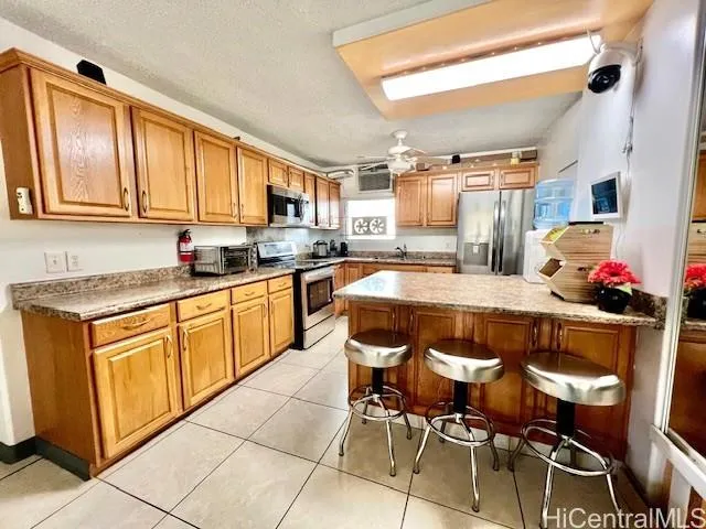 a kitchen with stainless steel appliances granite countertop a sink and cabinets
