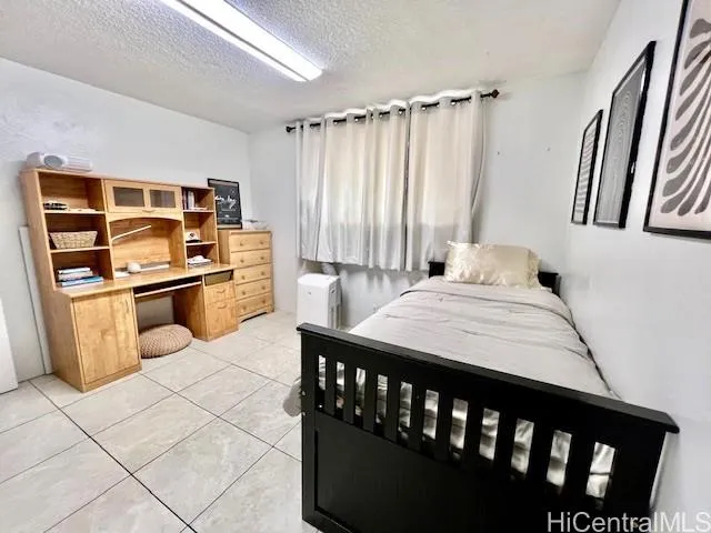 a kitchen with a stove a sink and a refrigerator