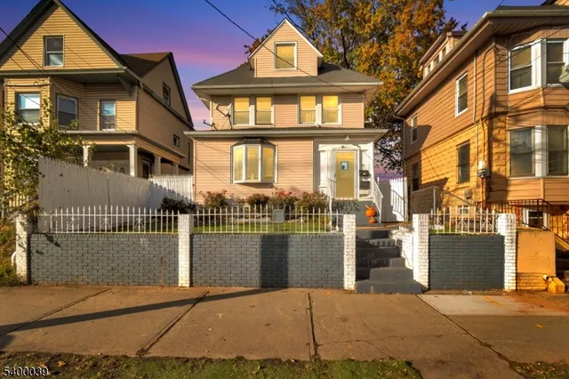 a view of a brick house with a outdoor space