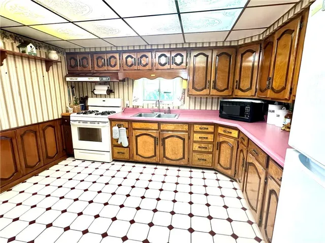 a kitchen with a stove and a refrigerator