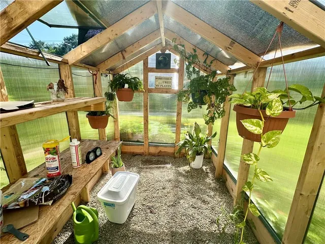 a front view of a house with outdoor seating