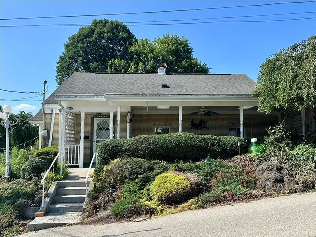 front view of a house and a garden