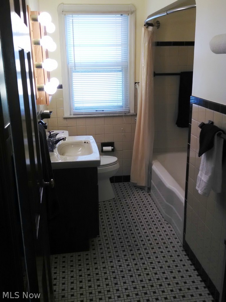 1404 South Green Road Cleveland, OH 44121 - Photo 10 of 23 First floor bathroom, new cabinets