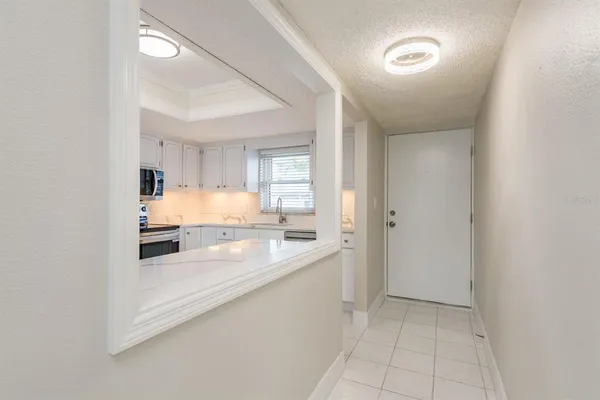 a bathroom with a granite countertop toilet sink and mirror