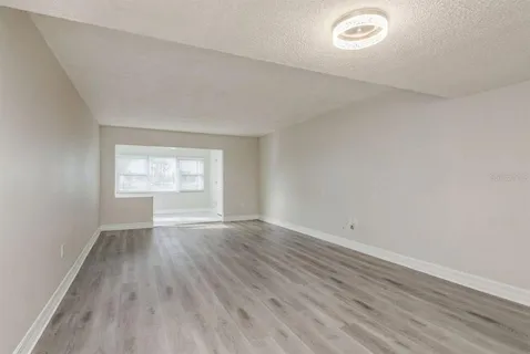 a view of an empty room with a window