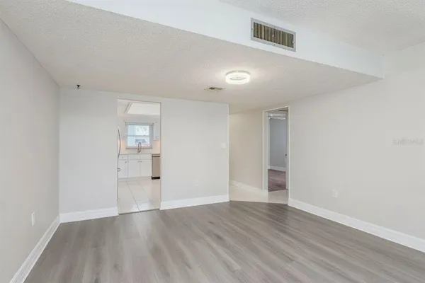 a view of backyard of house with seating space