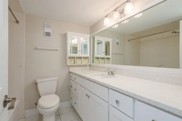 a view of a swimming pool with a patio and a fire pit