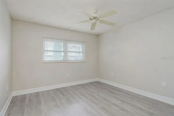 a view of a swimming pool with outdoor seating