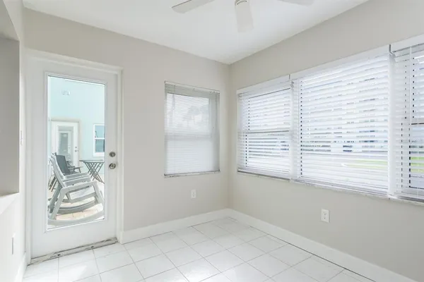 a view of a bedroom with clothes and shoes