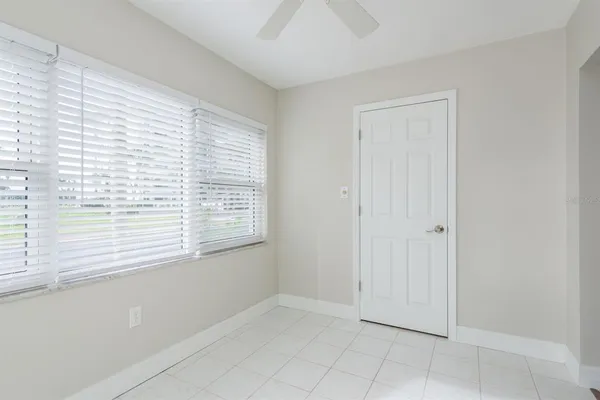 a view of a dinning table and chair in the patio