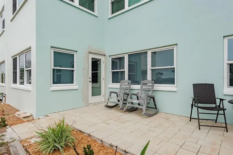 a view of a dinning table and chair in the patio