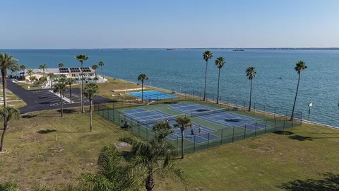 a living room with a table chairs and a window