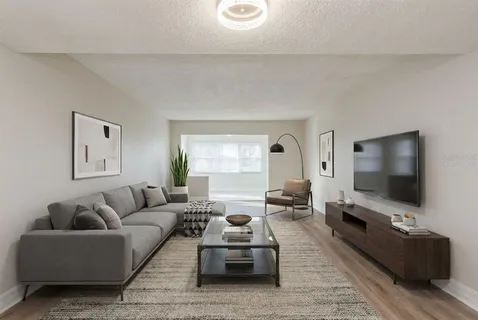 a kitchen with white cabinets stainless steel appliances and sink