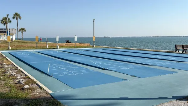 a view of a wooden floor with a lake view