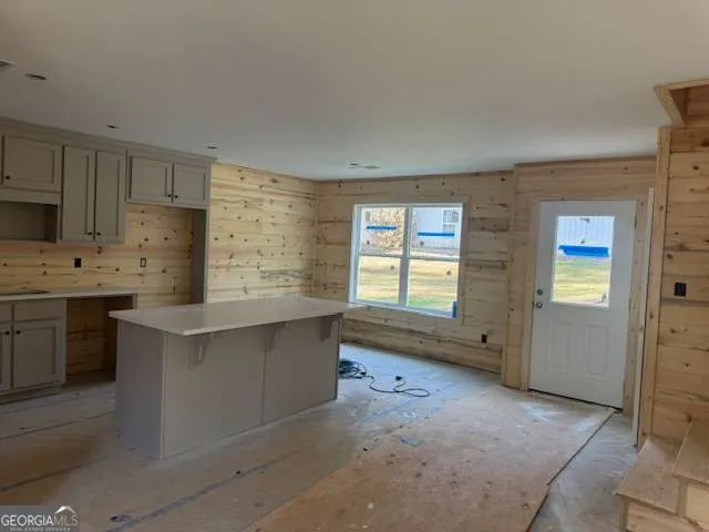 a kitchen with cabinets and window