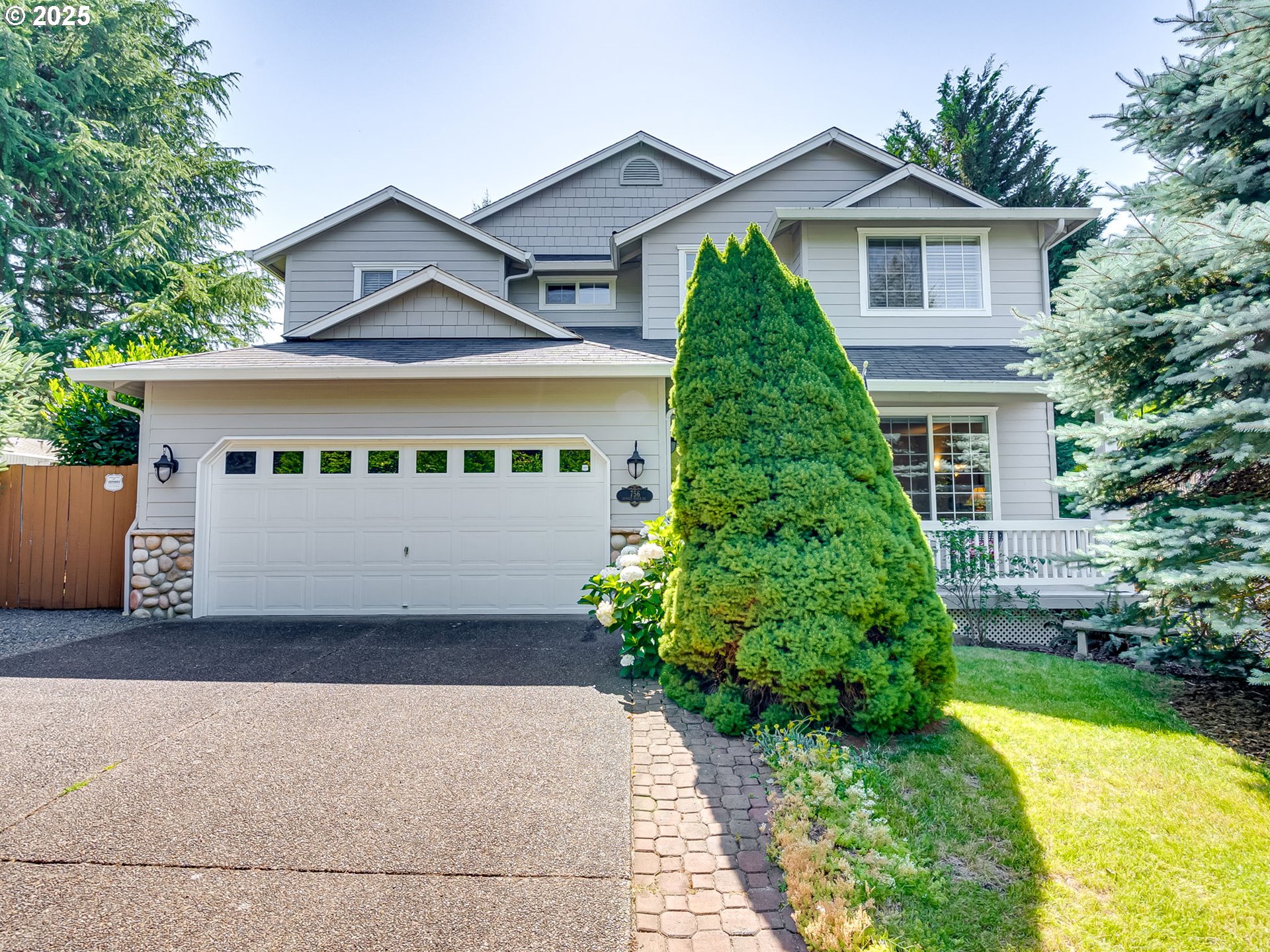 756 Sunset Ridge Drive Washougal, WA 98671 - Photo 2 of 47 a front view of a house with a yard and garage