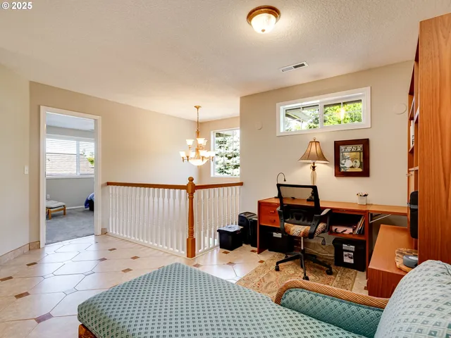 a bedroom with furniture and a window