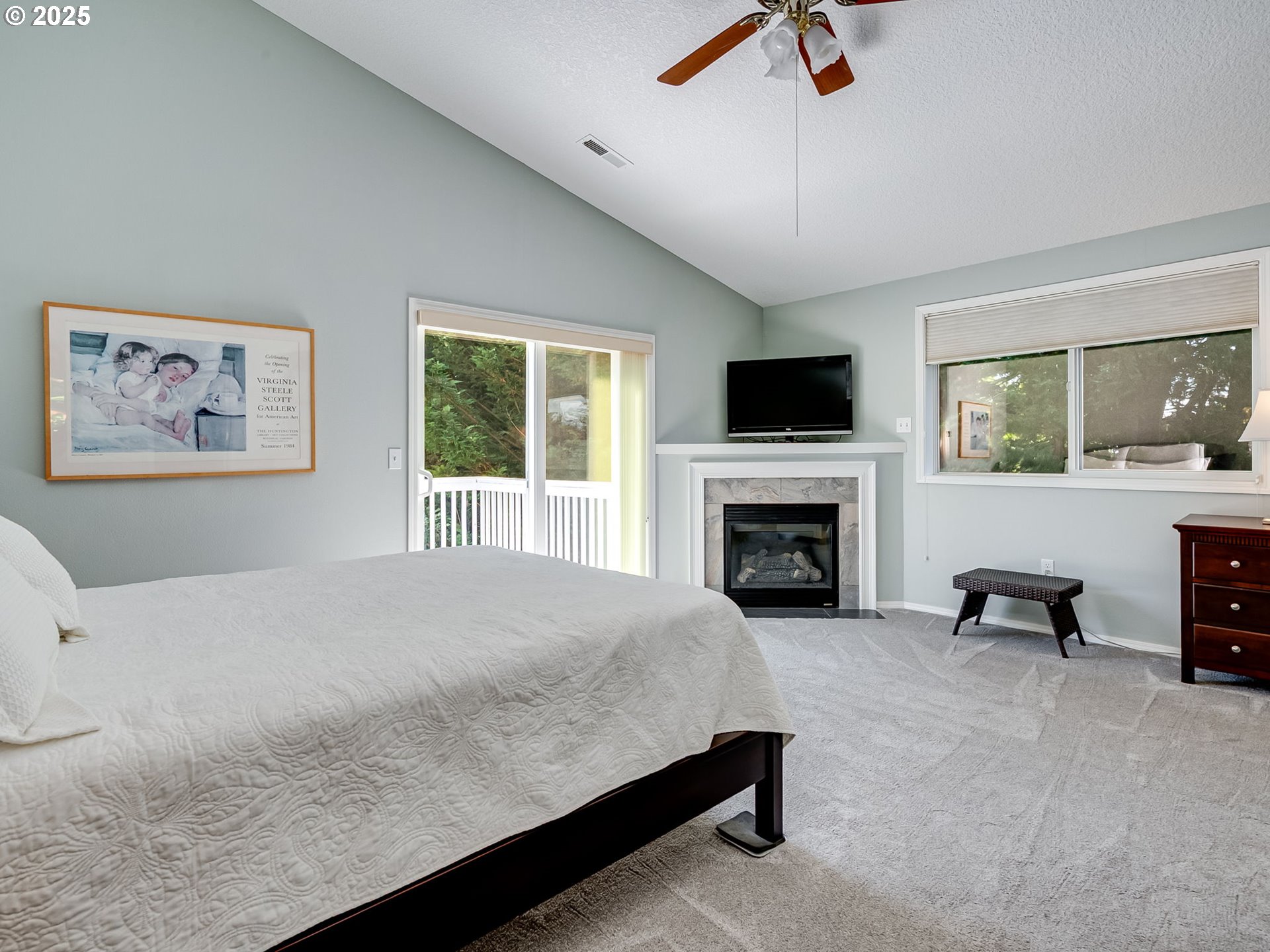 756 Sunset Ridge Drive Washougal, WA 98671 - Photo 26 of 47 a spacious bedroom with a large bed and a fireplace