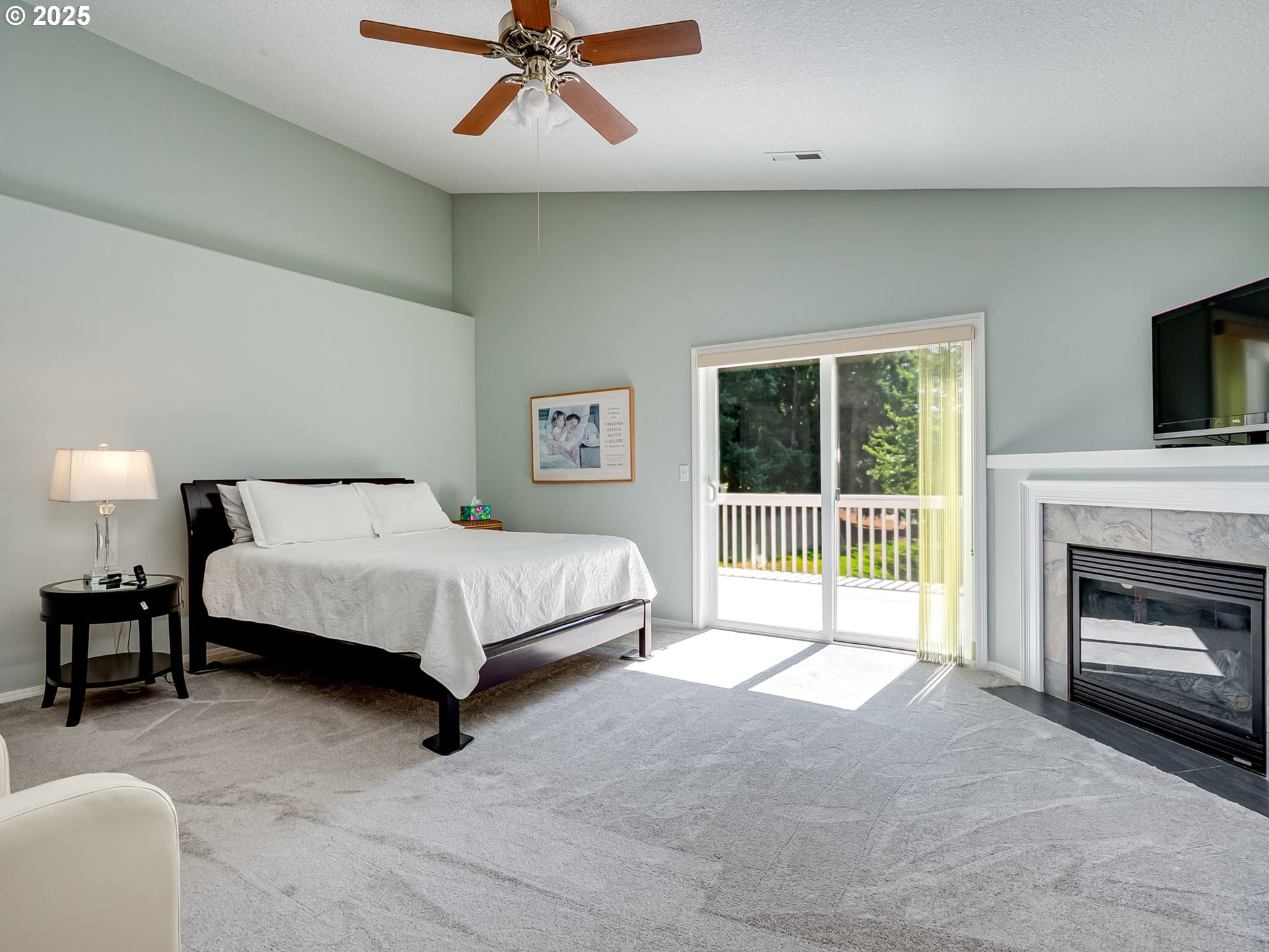 756 Sunset Ridge Drive Washougal, WA 98671 - Photo 27 of 47 a spacious bedroom with a bed and a fireplace