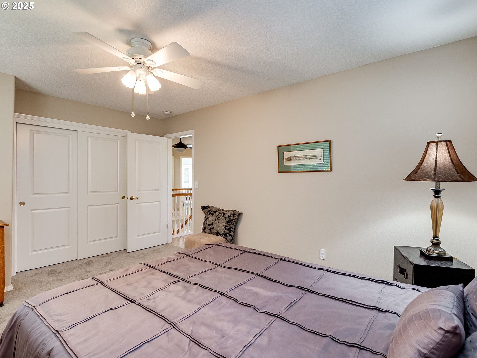 756 Sunset Ridge Drive Washougal, WA 98671 - Photo 35 of 47 a spacious bedroom with a bed and a chandelier