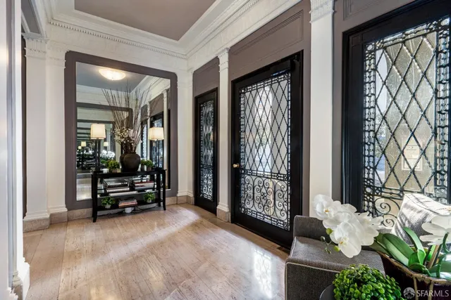 a view of a livingroom with furniture and a potted plant