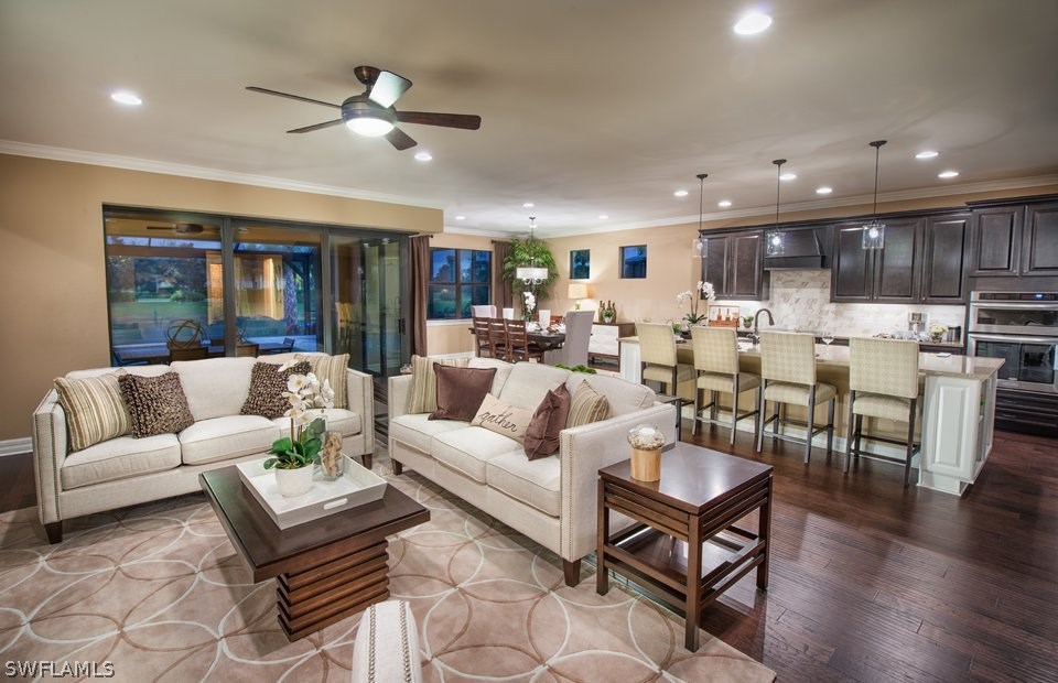 10812 Rutherford Road Fort Myers, FL 33913 - Photo 2 of 6 a living room with furniture kitchen and a wooden floor