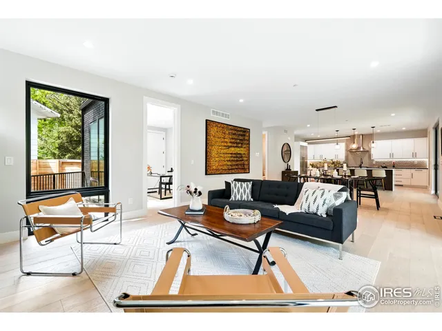 a living room with furniture and a table
