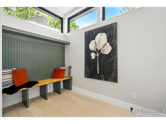 a view of a room with shelves and wooden floor