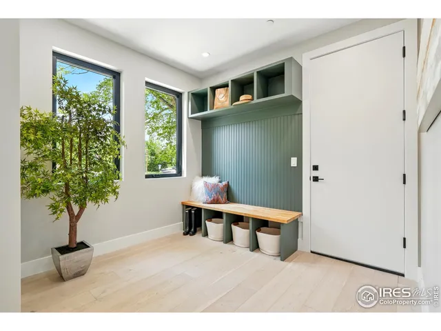 a room with a window and potted plant