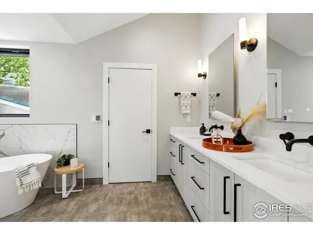 a white bath tub sitting next to a white sink