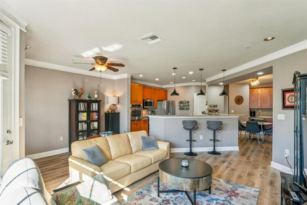 6319 Sunset Bay Circle Apollo Beach, FL 33572 - Photo 20 of 87 a living room with furniture and kitchen view