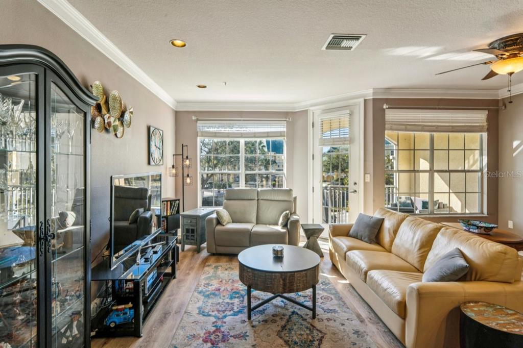 6319 Sunset Bay Circle Apollo Beach, FL 33572 - Photo 22 of 87 a living room with furniture and a flat screen tv