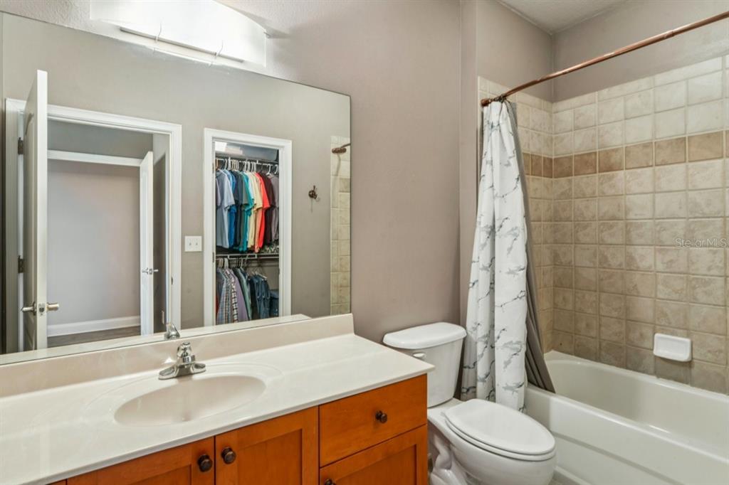 6319 Sunset Bay Circle Apollo Beach, FL 33572 - Photo 52 of 87 a bathroom with a sink a toilet and shower