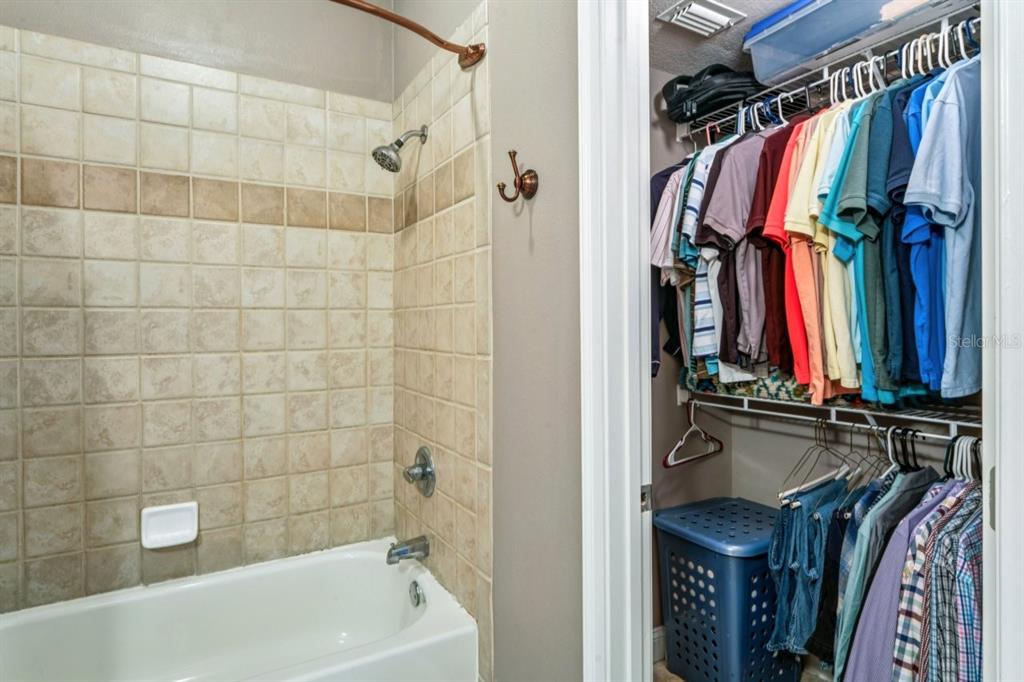 6319 Sunset Bay Circle Apollo Beach, FL 33572 - Photo 53 of 87 a view of walk in closet with clothes