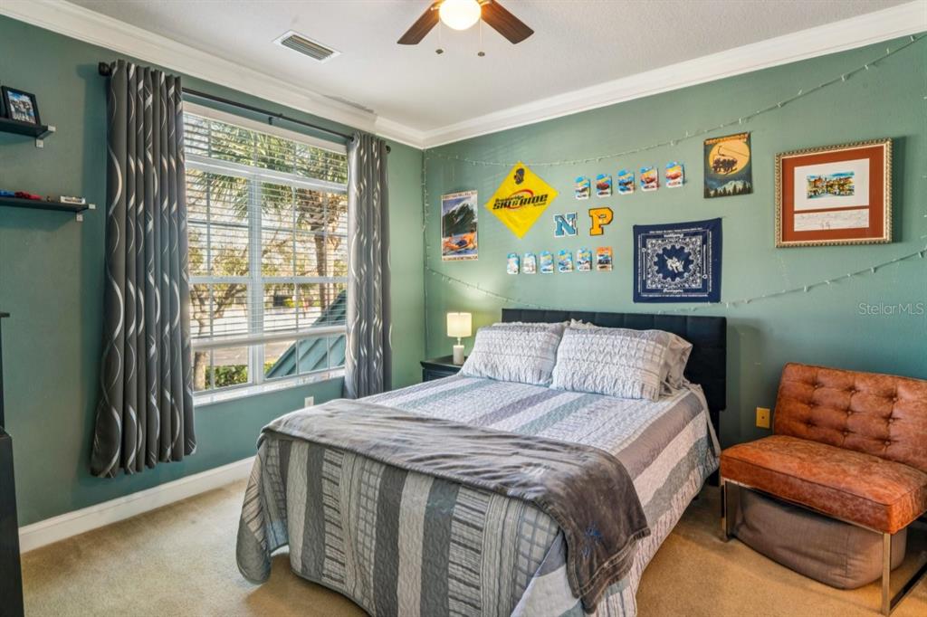 6319 Sunset Bay Circle Apollo Beach, FL 33572 - Photo 73 of 87 a bedroom with a bed and a couch