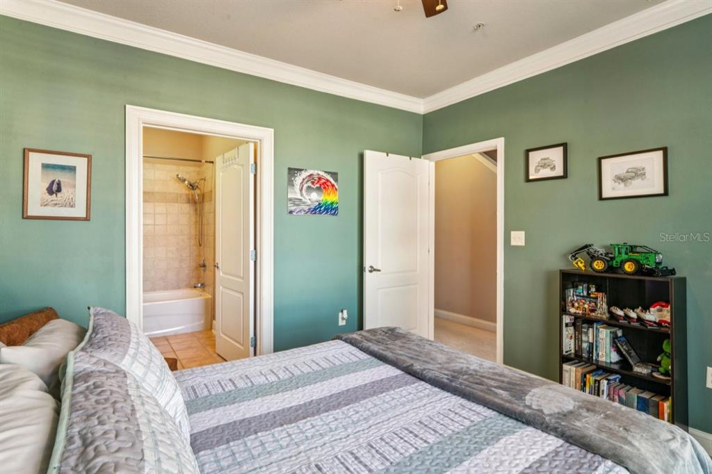 6319 Sunset Bay Circle Apollo Beach, FL 33572 - Photo 75 of 87 a bedroom with a bed and a closet