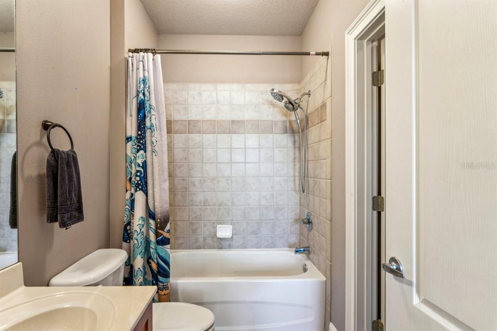 6319 Sunset Bay Circle Apollo Beach, FL 33572 - Photo 77 of 87 a bathroom with a bathtub and a shower