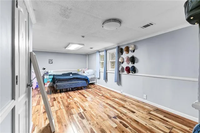 a bedroom with furniture and window