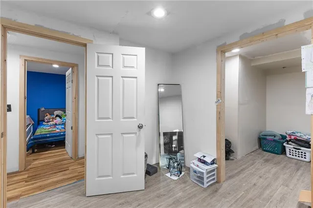 a bedroom with bed and a window