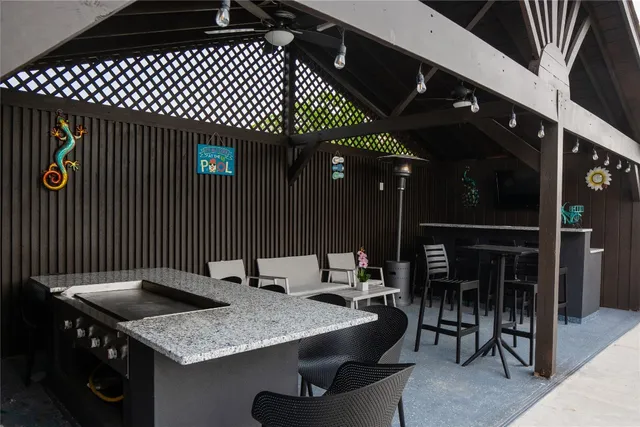 a terrace of a house with a table and chairs