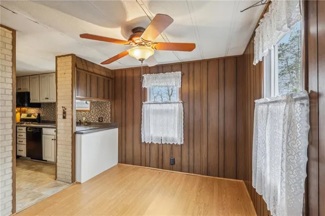 a view of a kitchen with a sink and cabinets