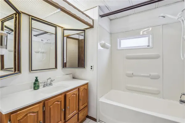 a bathroom with a double vanity sink and mirror