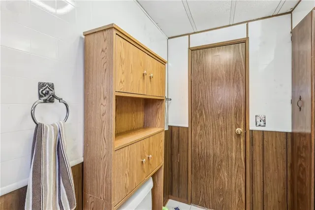 a bedroom that has a bed and a chandelier