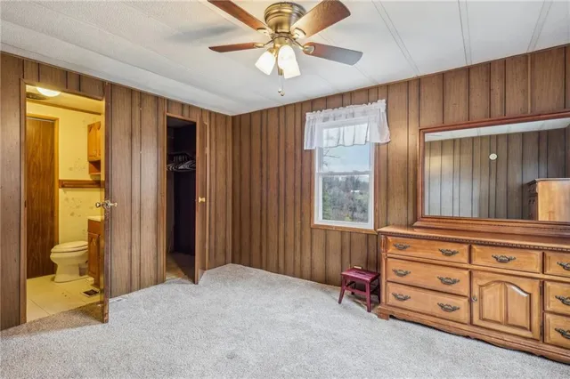 a view of walk in closet with clothes